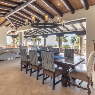 Dining area seating 8 with patio access
