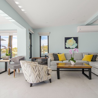 Unwind in your stylish living space with plush seating and panoramic windows that frame stunning views.