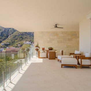 Your private terrace offers mountain views and comfortable seating where you can unwind with morning coffee or evening relaxation.