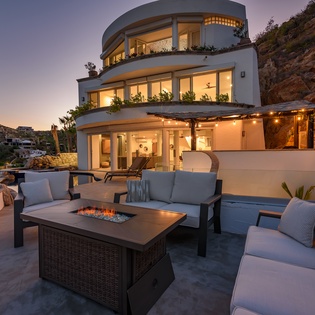 Sit by the cozy fire during sunset