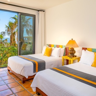 Bedroom suite with 2 queen beds and with incredible ocean views