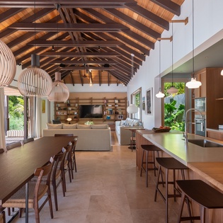 Gather around this stunning open-plan space where exposed beams crown your kitchen and dining area—perfect for memorable meals together.