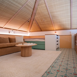 Relax in your private retreat with soaring bamboo ceilings, plush seating, and tropical design that makes every moment feel like paradise.