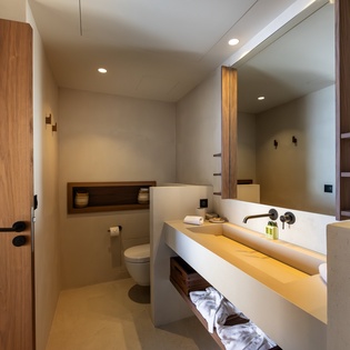 Unwind in this modern bathroom featuring a luxurious soaking tub, premium amenities, and sleek design that transforms your daily routine into pure relaxation.