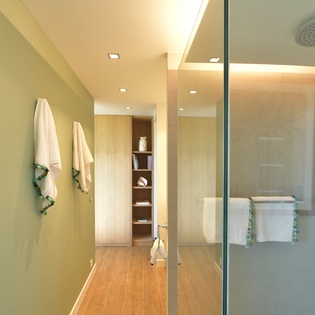 Step into your luxurious bathroom sanctuary where warm lighting and elegant finishes create the perfect spa-like retreat for your daily rituals.