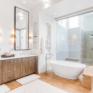 Step into your private sanctuary where a luxurious soaking tub and spa-like shower await. Warm wood tones and elegant fixtures create the perfect space to unwind after your adventures.