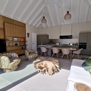 Unwind in this stunning open-concept space where vaulted ceilings and warm wood create your perfect home away from home.