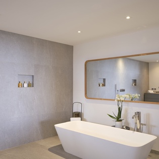 Sink into your private spa sanctuary with a stunning freestanding tub, rainfall shower, and elegant finishes that invite pure relaxation.