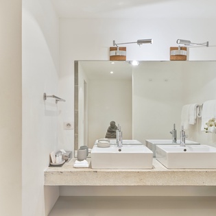 Step into your spa-like ensuite with dual sinks, rainfall shower, and elegant finishes for your daily refresh.