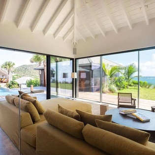 Stunning modern villa featuring ocean views, infinity pool, and open-plan living that seamlessly blends indoor comfort with tropical Caribbean beauty and endless horizons.