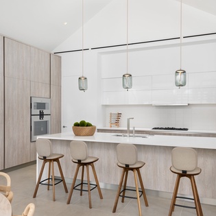 Your spacious kitchen invites culinary creativity with premium appliances, sleek countertops, and a welcoming breakfast bar for morning coffee.
