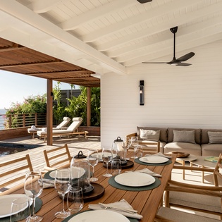 Dine al fresco in your covered terrace where sea breezes meet elegant comfort, with stunning ocean views just steps from your private pool.