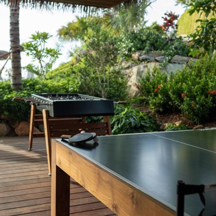 Challenge friends to games surrounded by tropical gardens and palm trees on your private deck.