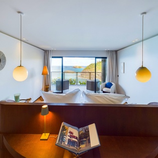 Your modern suite features stunning ocean views from your private terrace, perfect for morning coffee as you watch the sunrise over the water.