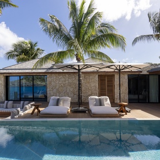 Beachfront luxury villa with private pool and tropical paradise views in a stunning oceanside location.