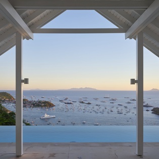 Step onto your private terrace and soak in breathtaking sea views across pristine waters dotted with yachts.