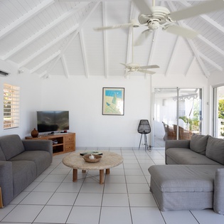 Relax in your bright open living space with soaring vaulted ceilings and gentle ceiling fan breeze.