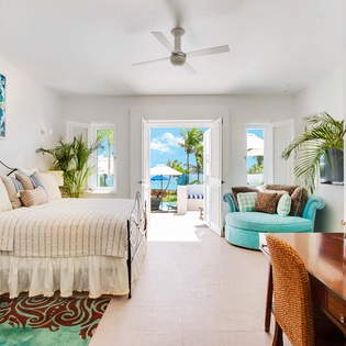 Step into your serene coastal retreat, where turquoise hues and ocean breezes greet you. Soft linens await, while French doors frame palm-swaying views that'll make every morning unforgettable.