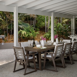Savor meals in your covered outdoor dining area with premium BBQ and tropical garden views.