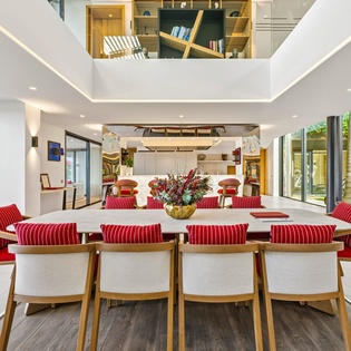 Gather around this stunning dining table where memorable meals and conversations unfold in your open-concept living space.