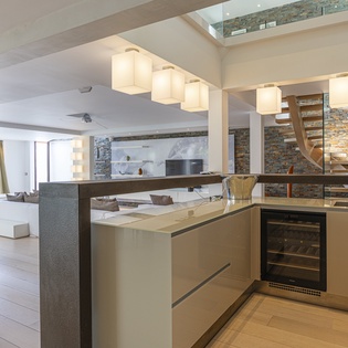 Step into an open-concept living space where natural light and striking architectural details set the stage for your getaway. Modern fixtures and warm accents invite you to unwind in style.