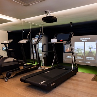 Your personal fitness haven awaits with state-of-the-art cardio equipment and an interactive entertainment wall to power through your workout.