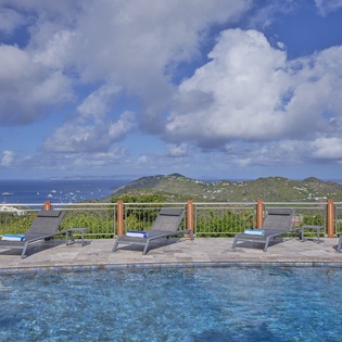 Dive into crystal-clear waters while taking in breathtaking ocean and mountain views from your private poolside paradise.
