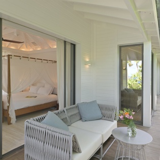 Your private terrace flows seamlessly into your romantic canopy bed suite, creating the perfect indoor-outdoor sanctuary.