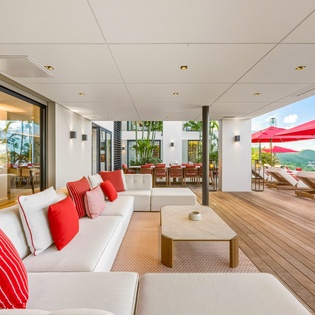 Unwind on your private terrace with stunning mountain views, plush seating, and seamless indoor-outdoor living.