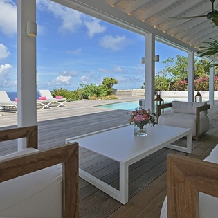 Relax in your private covered terrace with stunning ocean views and pool access.