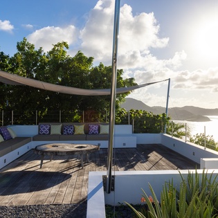 Unwind on your private rooftop terrace with panoramic ocean views, comfortable seating, and tropical breezes.