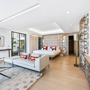 Your spacious suite combines bedroom and living area with contemporary design, artistic touches, and floor-to-ceiling windows.