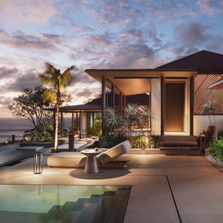 Stunning contemporary villa showcases modern architecture with infinity pool, tropical landscaping, and dramatic sunset skies overlooking the ocean.