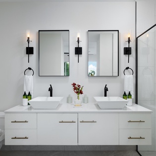 Unwind in your elegant ensuite with dual vanities, rainfall shower, and modern fixtures creating a spa-like sanctuary for two.