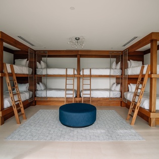 Your group will love this spacious bunk room with six custom beds, perfect for families or friends traveling together.