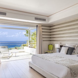 Wake up to the soothing sound of waves and step directly onto your private terrace, where breathtaking ocean views stretch endlessly before you.