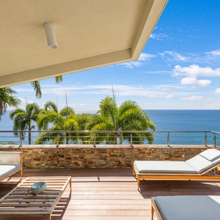 Your private terrace offers stunning ocean views with comfortable loungers where you can soak up the tropical sunshine and sea breeze.