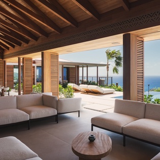 Sink into plush seating while breathtaking ocean views stretch endlessly before you in this open-air paradise.