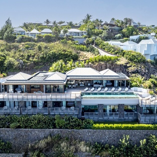 Stunning hillside luxury villa offering panoramic views and complete privacy in an exclusive neighborhood setting.