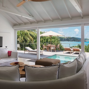 Relax in your open, airy living space with stunning ocean views, a private pool, and terrace just steps away—your perfect tropical escape.