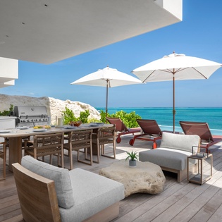 Soak up endless ocean views from your private terrace, where luxury meets paradise with premium seating and outdoor dining.