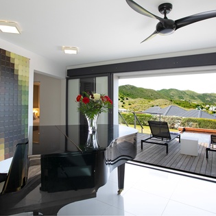 Step from your modern indoor space onto the expansive deck, where mountain views and fresh air create your perfect island retreat.