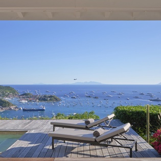 Breathtaking ocean views and infinity pool create your perfect tropical escape with luxurious poolside lounging.