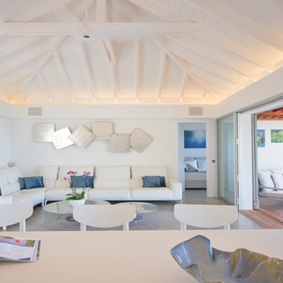 Relax in your bright living space with exposed beams and sliding doors opening to your private terrace.