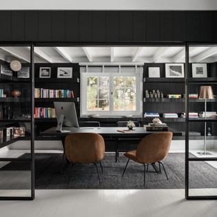 Your dedicated workspace awaits with built-in shelving, comfortable seating, and inspiring garden views to fuel your productivity.