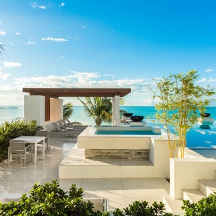 The property features a stunning oceanfront pool terrace, overlooking endless turquoise waters and serene island views, creating your own private paradise for sun-soaked days.