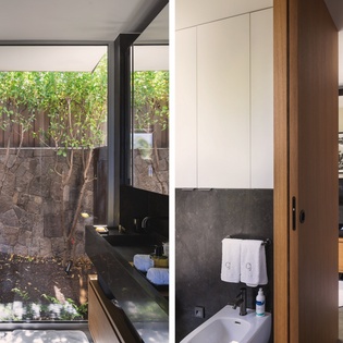 Soak in your private outdoor bathtub while gazing at lush greenery through floor-to-ceiling windows in this spa-inspired sanctuary.