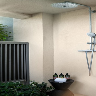 Refresh in your private outdoor shower surrounded by lush tropical greenery and premium amenities.