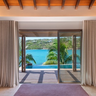 Wake up to stunning turquoise waters framed by your private terrace, where tropical paradise meets luxurious comfort in your elegant retreat.