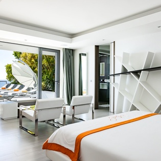 Wake up to stunning sea views from your luxurious suite, where modern elegance meets oceanfront serenity on your private terrace.